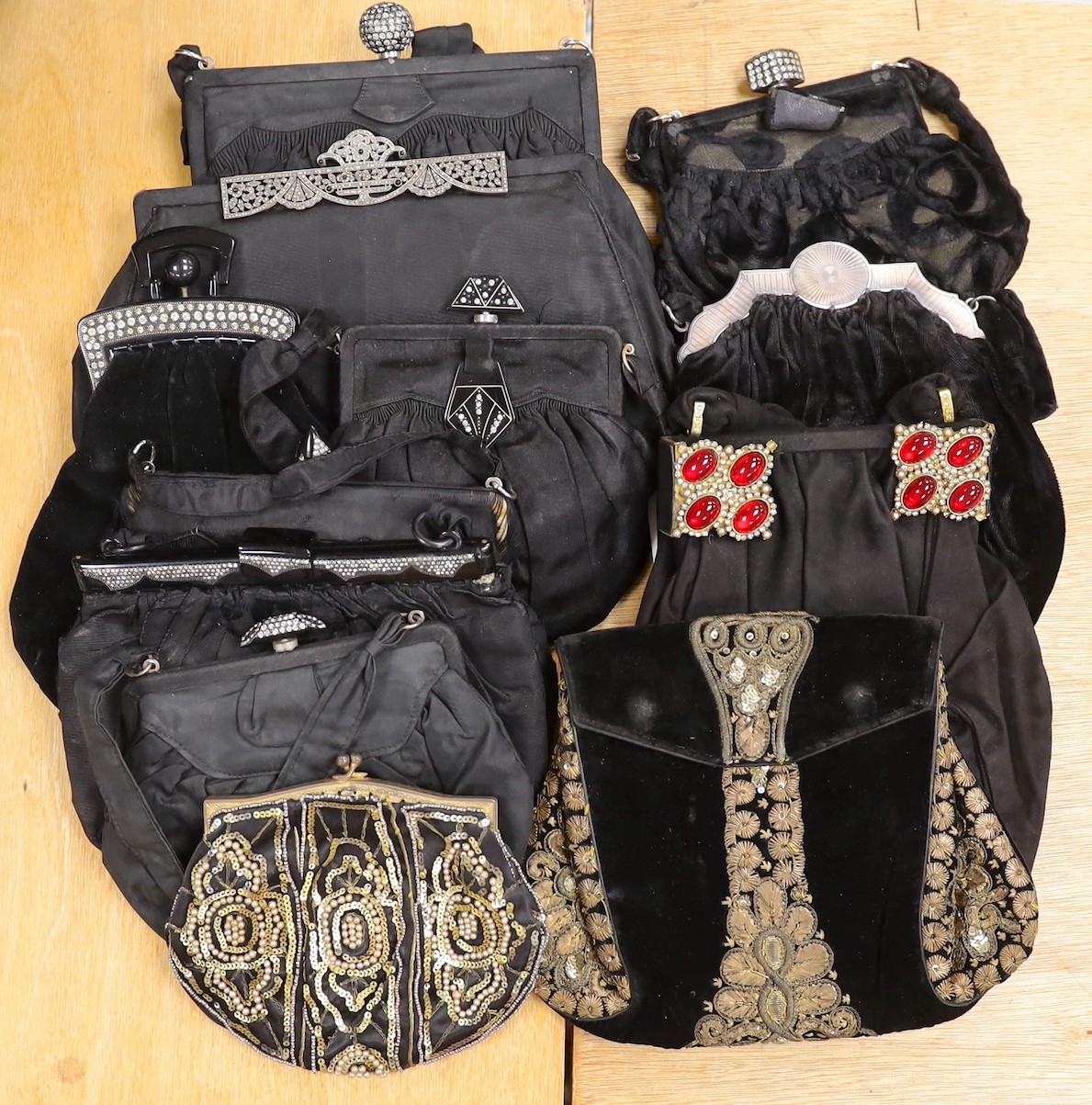 A 1930’s evening bag with silver frame, seven 1930’s-40’s evening bags with diamante encrusted Bakelite frames and clasps, a costume jewelled bag and two gilt and sequin bags